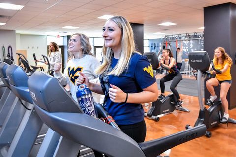 students working out on treadmills