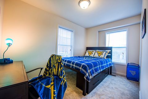 bedroom with WVU themed decoration